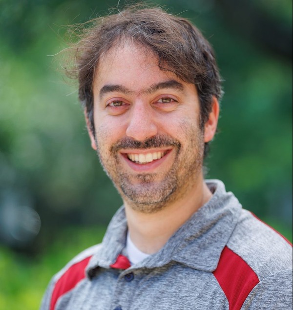 Dr. Armen Amirkhanian in front of greenery